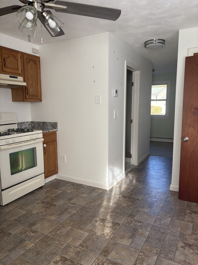 gas stove with hood - 183 Walnut Hill Rd Unit Left Side