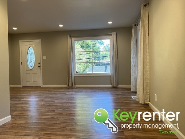 Photo - Modern Fircrest Gem: Sleek Design, Quartz Counters & Natural Oasis!