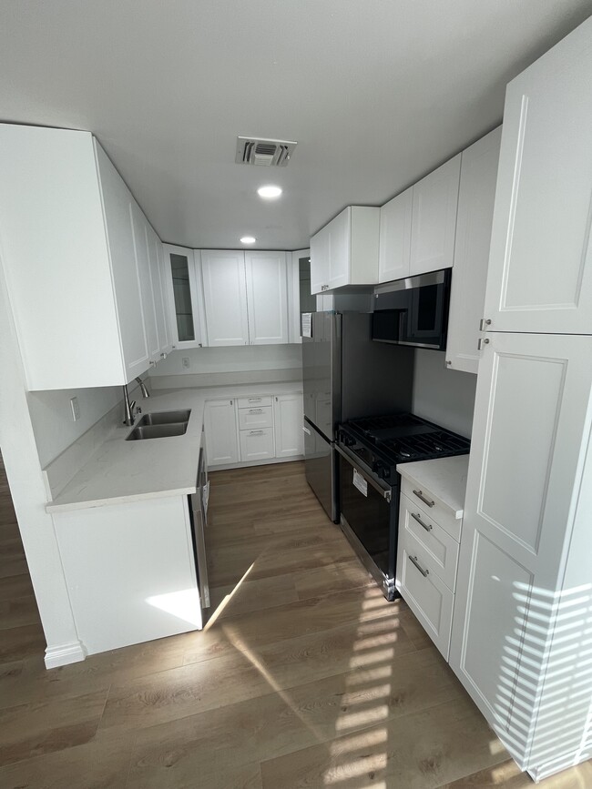 Renovated kitchen - 1469 S Bedford St Apartments