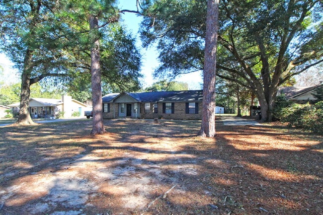 Building Photo - Spacious 4-Bedroom, 2-Bath Brick Home with Vaulted Ceilings, Fenced Yard, and Large Patio