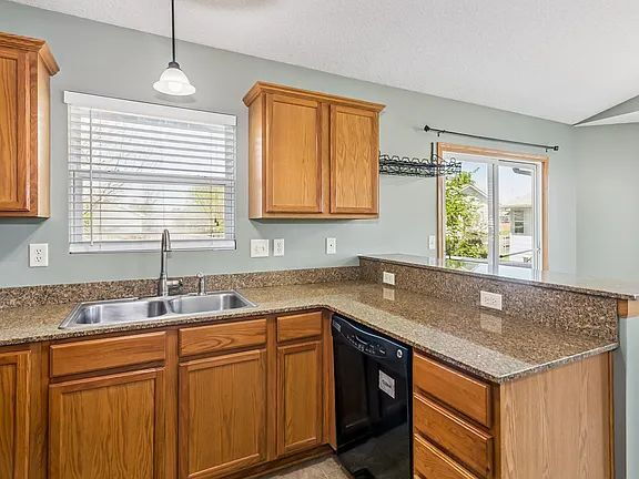 Photo - "Spacious 4-Bedroom Family Home with Cozy Fireplace in Wichita - 2261 Sq Ft of Comfort!"