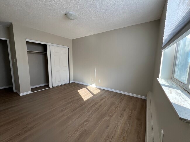 Spacious Bedroom with Built-in Closet - Newport Towers