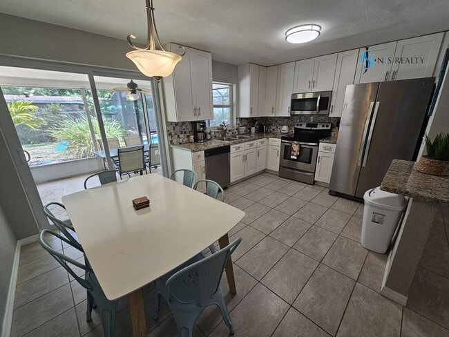 Photo - JUST REDUCED... must see beautiful 3/2 1071 Sq. Ft. with a POOL!! Gorgeous updated Kitchen & bath...