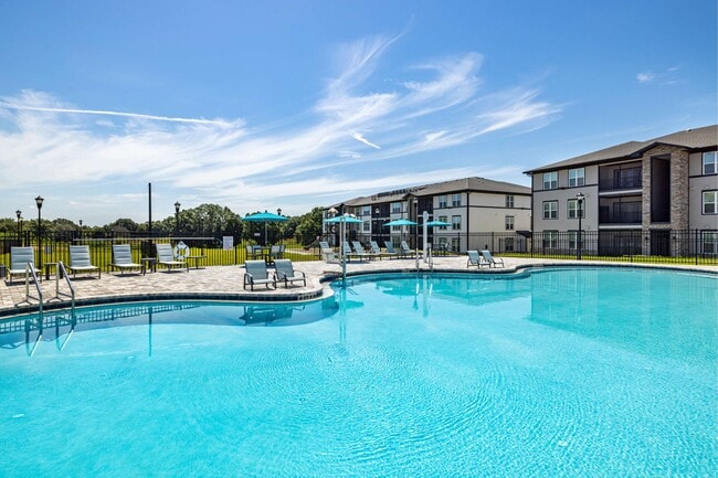 Community swimming pool and deck at The Groves at Lake Juliana