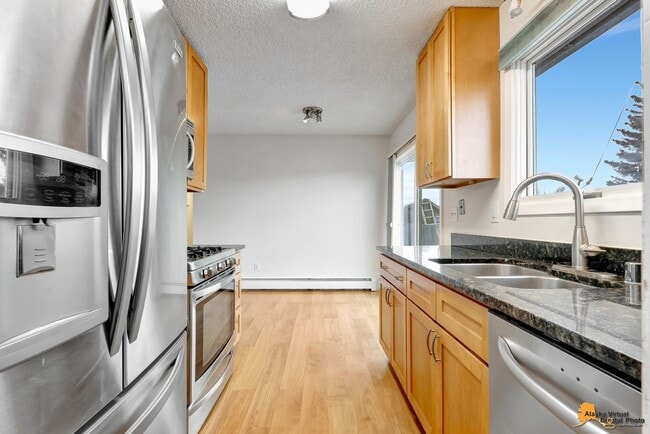 Building Photo - Cozy Abbott Loop Single Family Home w/ Garage & Fenced in Yard