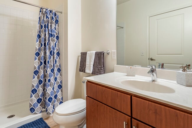 Newly renovated apartment homes feature baths with cherry cabinetry, white quartz countertops and hard surface flooring