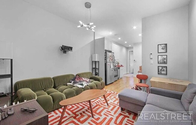 Photo - Spacious 3BR Apartment in Prime Bushwick | Skylight, Laundry, Courtyard | No Fee Unit 1L