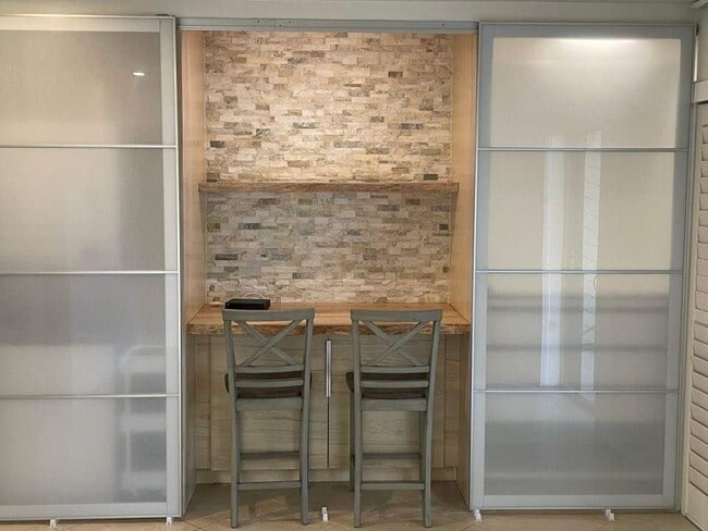 built in desk/counter flanked by the laundry center on the left and wardrobe on the right - 441 N Harbor City Blvd Unit D-3noble