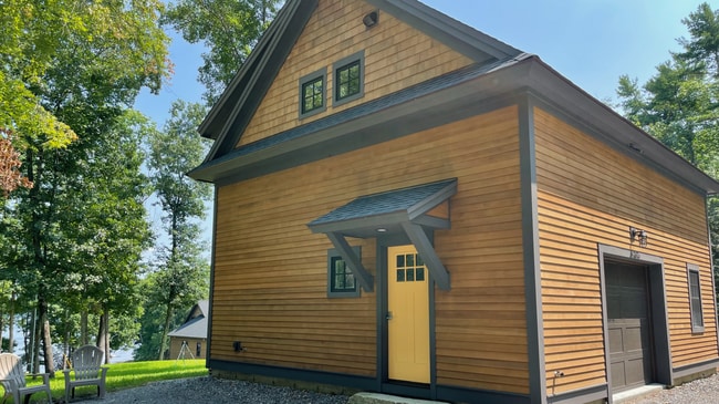 Entrance, garage, and a view of Little Bay (Great Bay) with owner's home in background - 297 Durham Point Rd