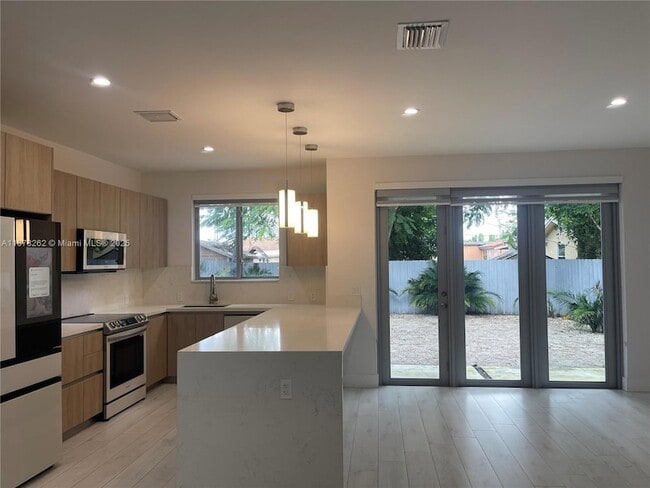 Building Photo - 3155 NW 103rd St Unit 3155