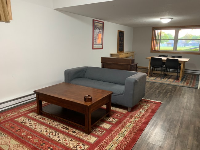 LR and DR with easy clean LVP flooring and large area rugs - 317 N Wasson Ln Apartments Unit B