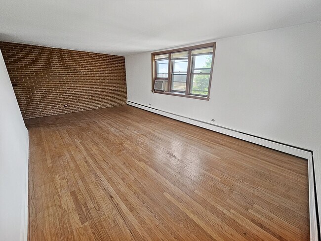 Photo - Mid-Century Modern 1-Bed + Den with Exposed Brick Unit 2727-2N