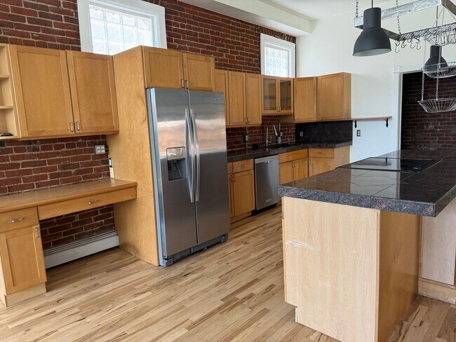 Photo - Located in the Historic Baker District, this uniquely converted warehouse features updates throug...
