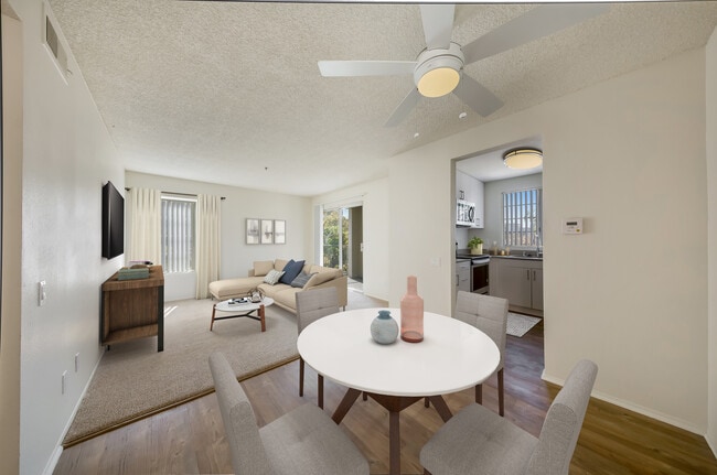 Renovated Package Dining area with hard surface plank flooring and living room with carpet