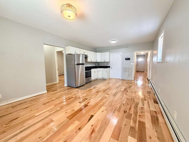 Photo - Move in July 1st • Spacious 1BR w/ Bonus Room Open Layout • Assigned Parking • Appliances • Garfield Unit B