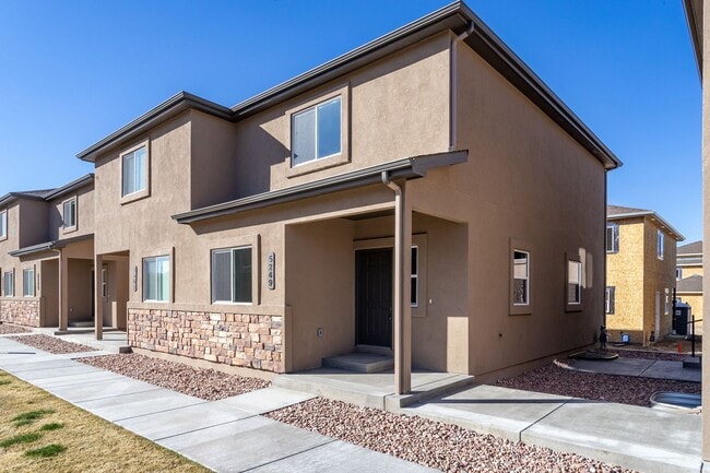 Building Photo - Unveiling Luxury Living: Townhomes with Main Level Office, Dual Master Suites, and Ample Storage ...