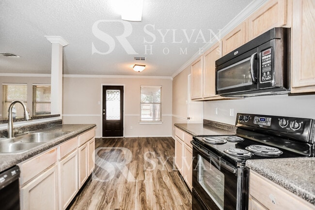 Photo - The living is easy in this gorgeous 4BR, 2.5BA brick home