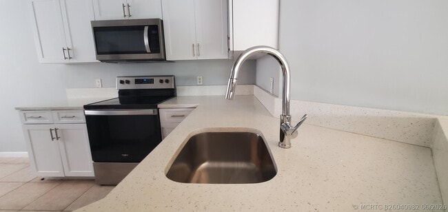 Photo - 9033 Wiles Rd Unit 308