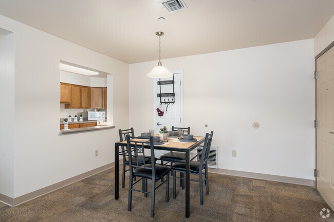 4BR, 2BA - 1,200SF - Dining Room - Honeysuckle Student Apartments