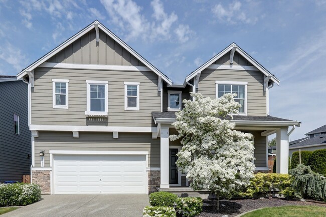 Photo - 4 Bedroom Home with Open Den, Living & Family Rooms – Space for Everyone