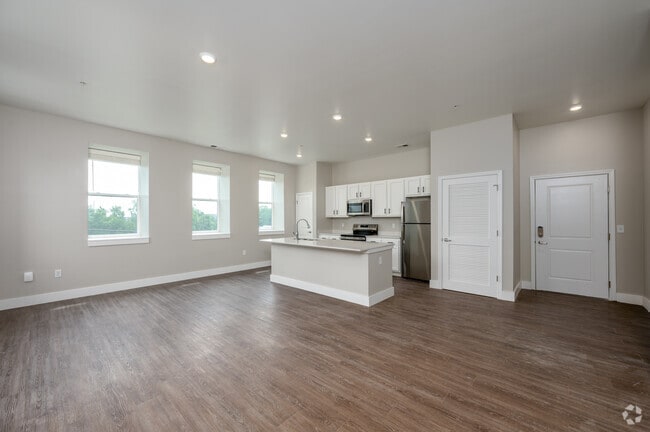 2BR, 2.5BA - 1,561SF - Living Room/Kitchen - The Assumption on Blaine Apartments