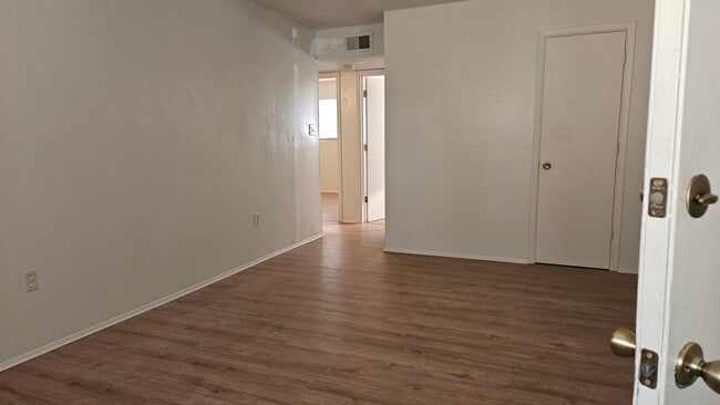 Living room toward bedrooms. - 544 Chama St SE Unit C