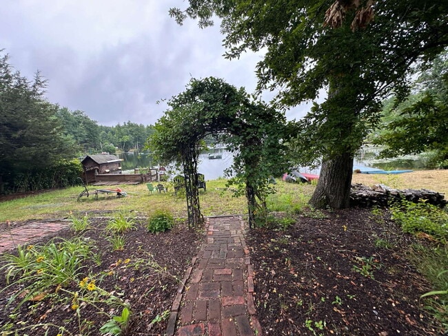 Photo - Peaceful Waterfront Living: 2-Story Home on River Road with Ample Outdoor Storage & Water Extras!