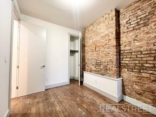 Photo - True 4 Bedroom layout — no flex, no railroad - Massive full-floor basement with second private entra Unit 1L