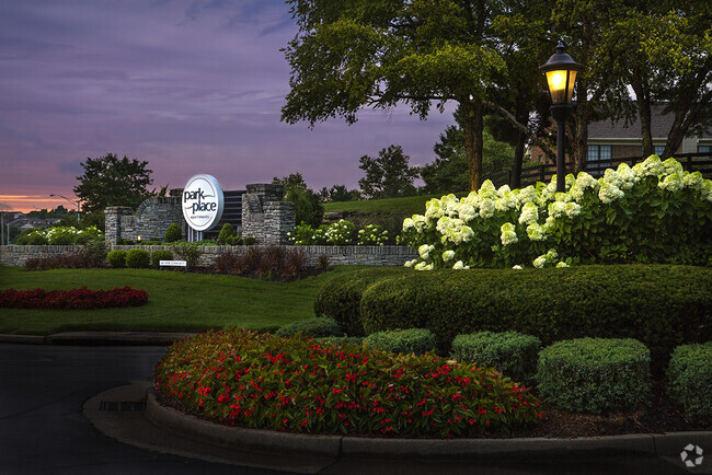 Park Place community entrance at dusk - Park Place Apartments