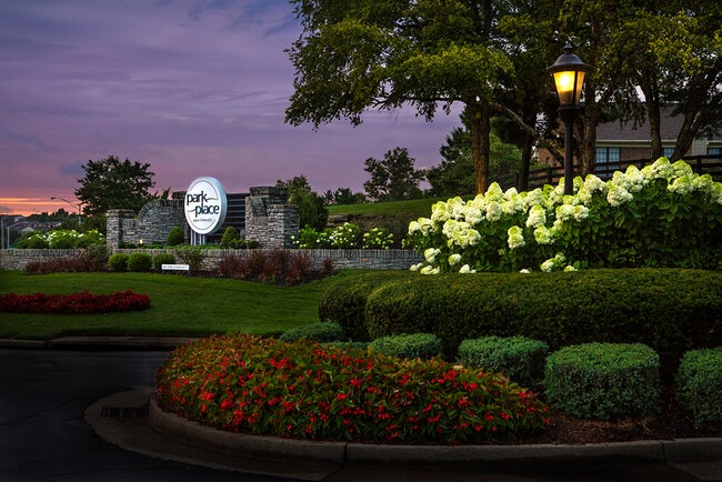 Park Place community entrance at dusk - Park Place Apartments