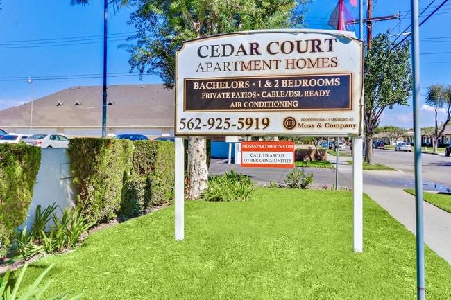 Cedar Court Apartment Homes signage, Bachelors, 1 and 2 bedrooms, private patios, cable/DSL Ready, air conditioning, 562-925-5919 - Cedar Court Apartments