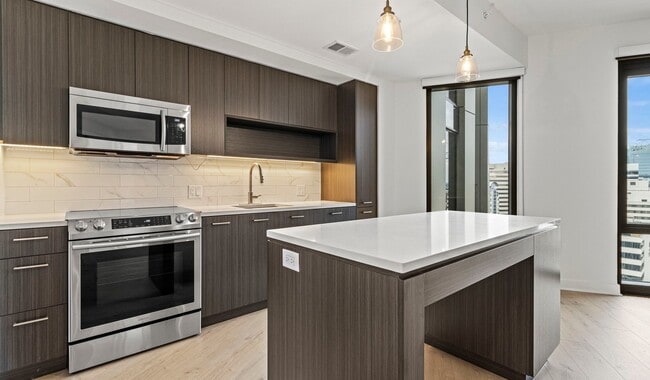 Large, functional kitchens with bar top island seating make the best your home space