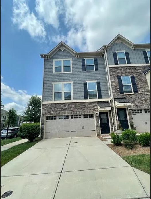 Building Photo - Three story town home with 2 car garage