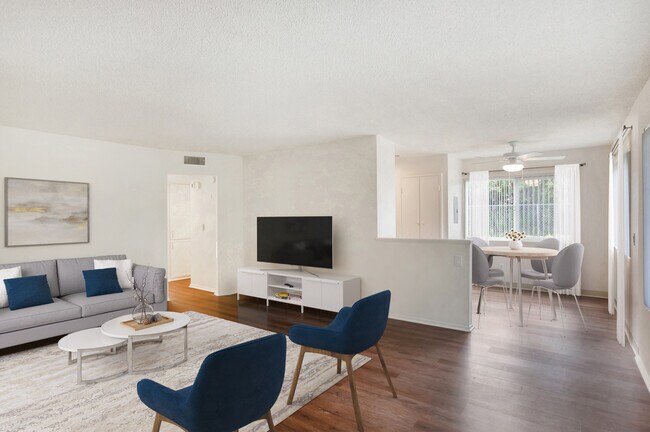Renovated Package I living and dining area with hard surface flooring