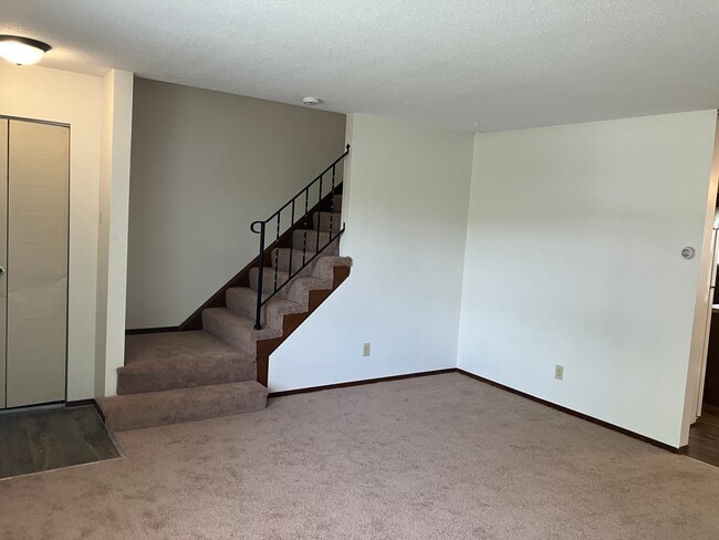 Living room going up to bedrooms and full bath