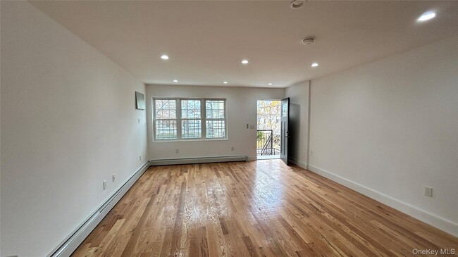 Building Photo - 69-31 Burchell Ave Unit 1