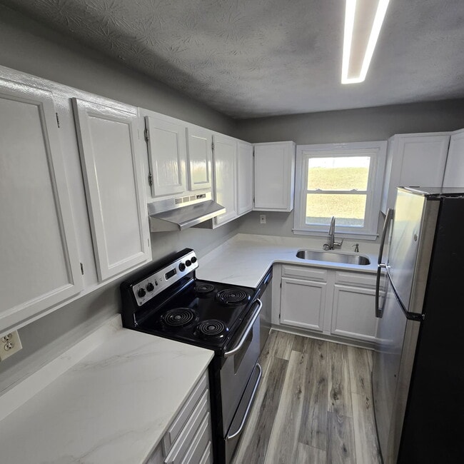 Photo - @ Bedroom Townhome conveniently located near the interstate, hospital, airport, entertainment and...