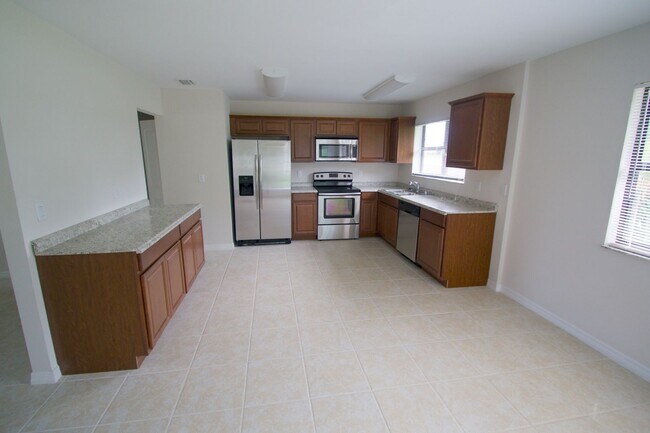 Photo - Waterfront 3BR Home on Canal | Spacious Yard | Lawn Care Included | Pet Friendly