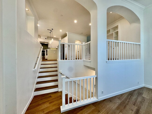 Building Photo - Beautifully Remodel Townhouse with AC & Two Car Garage!