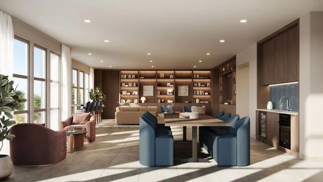 Clubroom with custom built-ins, communal dining space, and lounge seating arranged for conversation or quiet co-working.