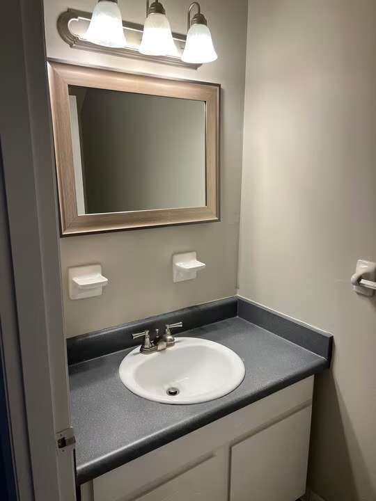 Elevate your lifestyle at Arbor Terrace with this chic and modern bathroom, featuring sleek finishes and ample storage. Perfect for your daily routine, this space combines functionality with style. Schedule a visit today to see more!
