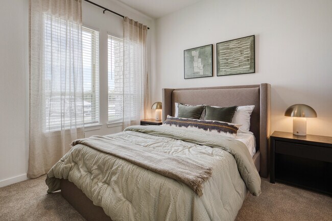 Bright, spacious bedroom with abundant natural light at Sageland Flats at Brooks