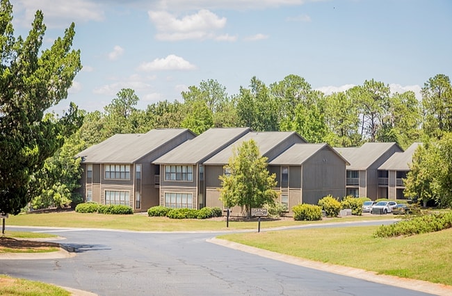 Experience serene living at this beautiful apartment community, nestled among nature. - Corder Crossing