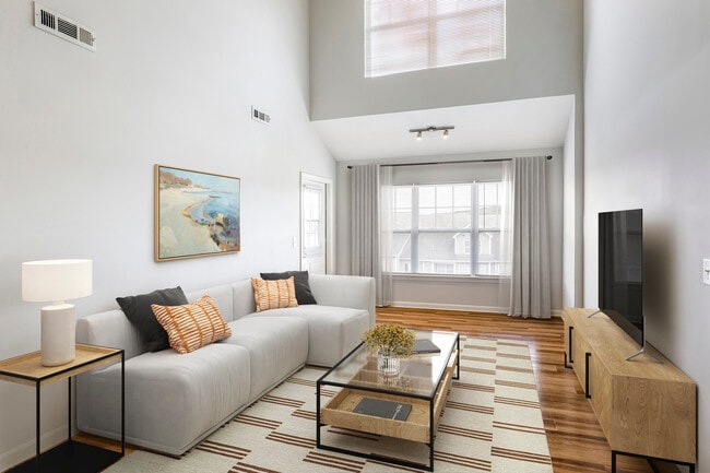 Renovated Package I living room with hard surface flooring