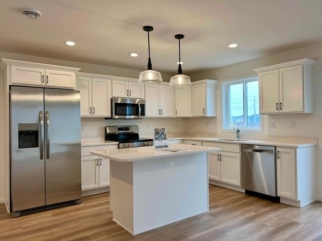 Photo - Spacious & Stylish 3-Bed Home with Modern Finishes and Attached 2-Stall Garage