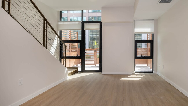 Living Room with Hard Surface Flooring - Skyhouse Denver