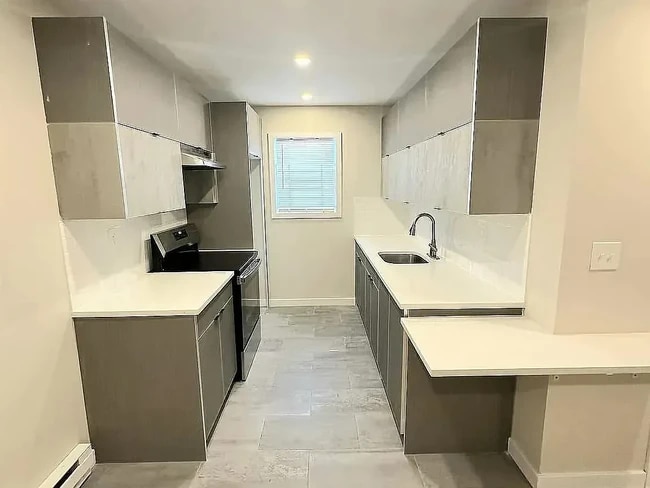 Building Photo - 307-347-347 Littleton Ave Unit 311-3A