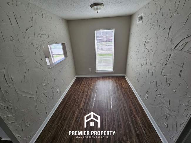 Photo - Move-In Ready 3BR Gem in Memphis - Cozy Fireplace, Tile Dining & Private Yard