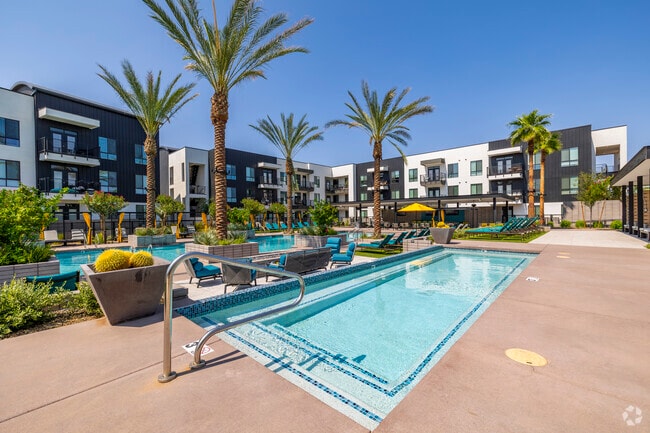 Resort-style pool with tanning area and view deck