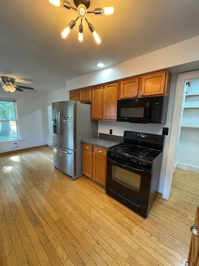 Photo - 3-Bedroom House with Theater-style Basement | Parking, Laundry, & Fenced Yard